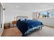 Relaxing bedroom with a large window and cozy decor at 2200 Teller St, Lakewood, CO 80214