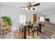 A cozy dining room with a table, setting, and a decorative rug at 2200 Teller St, Lakewood, CO 80214