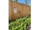 This garden features a pollinator-friendly garden along a fence, complete with a bird bath at 2200 Teller St, Lakewood, CO 80214