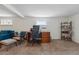 Cozy home office area with desk, shelving, and ample natural light at 2200 Teller St, Lakewood, CO 80214