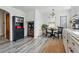Eat-in kitchen with breakfast table and chairs plus wooden and black storage units at 2200 Teller St, Lakewood, CO 80214