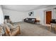 Spacious living room features neutral decor, comfortable seating and bright lighting at 2200 Teller St, Lakewood, CO 80214