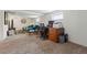 Basement living room features an office workspace in a carpeted area at 2200 Teller St, Lakewood, CO 80214