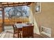 Patio with dining table set, outdoor grill, and fenced backyard at 2200 Teller St, Lakewood, CO 80214