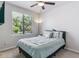 Bright bedroom featuring a large window and a comfortable bed with accent pillows at 25402 E Glasgow Pl, Aurora, CO 80016