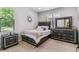 Stylish bedroom with modern furniture, including a platform bed and dresser at 25402 E Glasgow Pl, Aurora, CO 80016