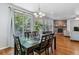 Open dining space with wood floors, fireplace, an eating area and natural light at 25402 E Glasgow Pl, Aurora, CO 80016