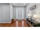 Inviting entryway with wood floors, recessed lighting, and tasteful decor at 25402 E Glasgow Pl, Aurora, CO 80016
