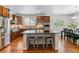 Bright eat-in kitchen includes stainless appliances, wood floors and a large center island at 25402 E Glasgow Pl, Aurora, CO 80016