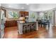 Spacious eat-in kitchen features stainless steel appliances, island, and a dining area at 25402 E Glasgow Pl, Aurora, CO 80016
