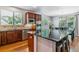 Open kitchen with island, granite countertops, modern appliances, and a breakfast nook at 25402 E Glasgow Pl, Aurora, CO 80016