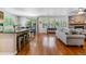 Open-concept living area with eat-in kitchen, dining space, and a cozy living room at 25402 E Glasgow Pl, Aurora, CO 80016