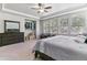 Spacious main bedroom featuring large windows, ceiling fan, and a cozy sitting area at 25402 E Glasgow Pl, Aurora, CO 80016