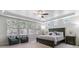 Serene main bedroom featuring tray ceiling, plush carpeting, and ample natural light at 25402 E Glasgow Pl, Aurora, CO 80016