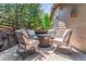 Inviting outdoor patio with a stone fire pit surrounded by comfortable seating for cozy evenings at 25402 E Glasgow Pl, Aurora, CO 80016