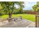 Wood deck with benches overlooks large green backyard at 7431 Webster St, Arvada, CO 80003