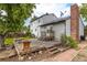 Backyard deck features multiple benches and has access to brick patio at 7431 Webster St, Arvada, CO 80003