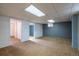 Large finished basement area with multiple rooms and carpet flooring at 7431 Webster St, Arvada, CO 80003