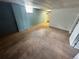 Spacious carpeted basement with light blue walls and a small window at 7431 Webster St, Arvada, CO 80003