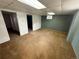 Basement room with carpet, blue walls, and a small window at 7431 Webster St, Arvada, CO 80003