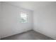 This cozy bedroom includes a window for natural light and neutral carpet at 7431 Webster St, Arvada, CO 80003