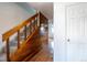 A carpeted staircase with wood railings provides access to upper levels of the home at 7431 Webster St, Arvada, CO 80003