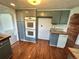 Well-equipped kitchen featuring built-in ovens, ample cabinet space, and a convenient layout at 7431 Webster St, Arvada, CO 80003