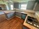 Cozy kitchen boasts wood countertops, stylish cabinetry, and modern appliances, ideal for culinary enthusiasts at 7431 Webster St, Arvada, CO 80003