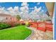 A beautiful backyard featuring a wood deck and manicured lawn, perfect for relaxation and outdoor enjoyment at 12287 W Aqueduct Dr, Littleton, CO 80127