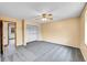 Cozy bedroom features a sliding closet, a ceiling fan, and natural light at 12287 W Aqueduct Dr, Littleton, CO 80127
