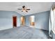 Airy primary bedroom featuring walk in closet, ensuite bathroom and neutral paint at 12287 W Aqueduct Dr, Littleton, CO 80127