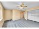 Comfortable bedroom with sliding door closet, ceiling fan and standard window at 12287 W Aqueduct Dr, Littleton, CO 80127