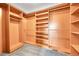 Well-organized walk-in closet with custom shelving and ample storage solutions at 12287 W Aqueduct Dr, Littleton, CO 80127