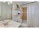 Cozy bathroom features a tub, shower, and floating shelves at 21 N Washington St # 301, Denver, CO 80203
