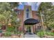 The building is brick with covered front entry and landscaping at 21 N Washington St # 301, Denver, CO 80203