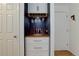 Hallway featuring a dry bar with updated cabinets and storage at 21 N Washington St # 301, Denver, CO 80203