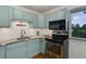 Modern kitchen featuring sleek appliances and stylish countertops at 21 N Washington St # 301, Denver, CO 80203