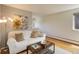 Bright living room with stylish decor, hardwood floors, and a cozy sofa at 21 N Washington St # 301, Denver, CO 80203