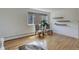 Bright living space with hardwood floors, decorative shelves, and sunny windows at 21 N Washington St # 301, Denver, CO 80203