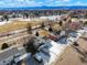 Beautiful aerial view of home and neighborhood with mountain views in the distance at 6190 W Canyon Ave, Littleton, CO 80128