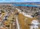 High angle aerial of a Gathering neighborhood with lake access and community walking trails at 6190 W Canyon Ave, Littleton, CO 80128