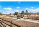 Park bench on a paved path in a community park at 6190 W Canyon Ave, Littleton, CO 80128