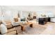 Bright living room with a decorative rug, fireplace and natural light at 6190 W Canyon Ave, Littleton, CO 80128