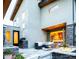 Stylish backyard features outdoor seating, a fire pit, and a view of the kitchen through open doors at 4251 Perry St, Denver, CO 80212