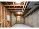 Unfinished basement area showing the concrete walls, utilities, and wooden supports, ready for customization at 4251 Perry St, Denver, CO 80212