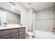 Modern bathroom with tiled shower and gray vanity at 4251 Perry St, Denver, CO 80212