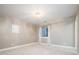 Bedroom with large window and modern light fixture at 4251 Perry St, Denver, CO 80212