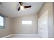 Bright bedroom features a ceiling fan, window, and closet at 4251 Perry St, Denver, CO 80212