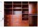 Organized closet with dark wood drawers and ample shelving at 4251 Perry St, Denver, CO 80212