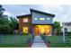 Striking modern home showcasing a unique architectural design, wood accents, and inviting front porch at 4251 Perry St, Denver, CO 80212